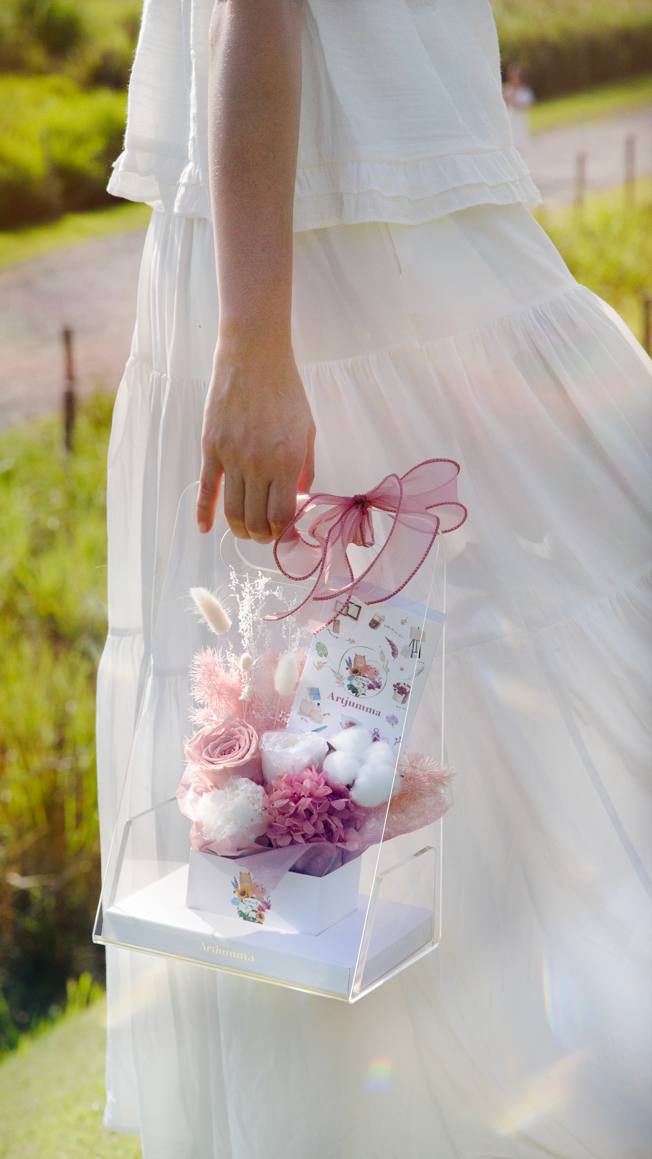 Pink flower bouquet for flower girl basket at party.