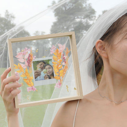polaroid film and pressed preserved flower